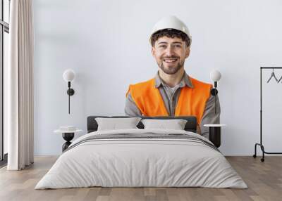 Young construction workers in hard hats and hamlet on a white background Wall mural